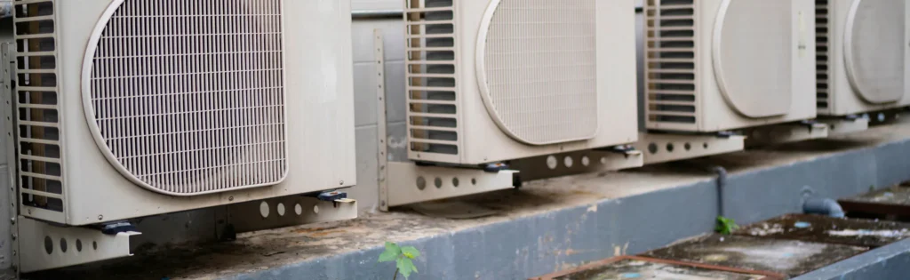 Air conditioning units neatly lined up on a wall, providing efficient cooling solutions. 2600