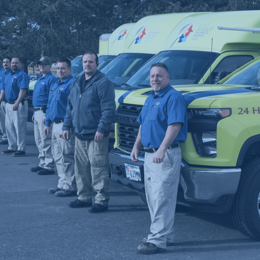 All Utah Plumbing, Heating & Air team photo of guys standing in front of company trucks
